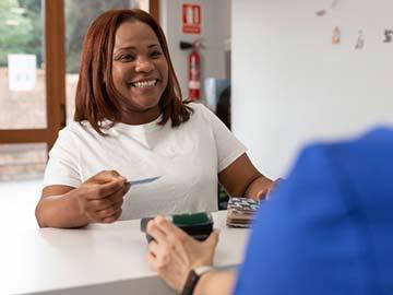 Patient paying for dental treatment