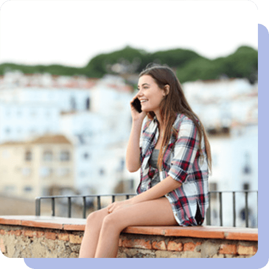 Teenage girl smiling on a phone call