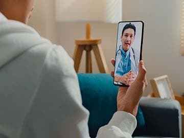 Person having a video call with a GP