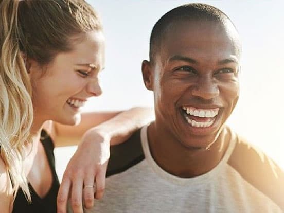 Man and woman smiling together