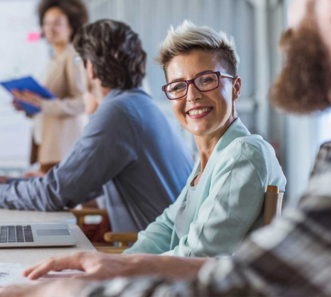 Colleagues working together on laptops